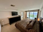 Master bedroom with ocean view and balcony